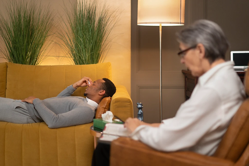 After hours GP examining a patient during a late night medical visit