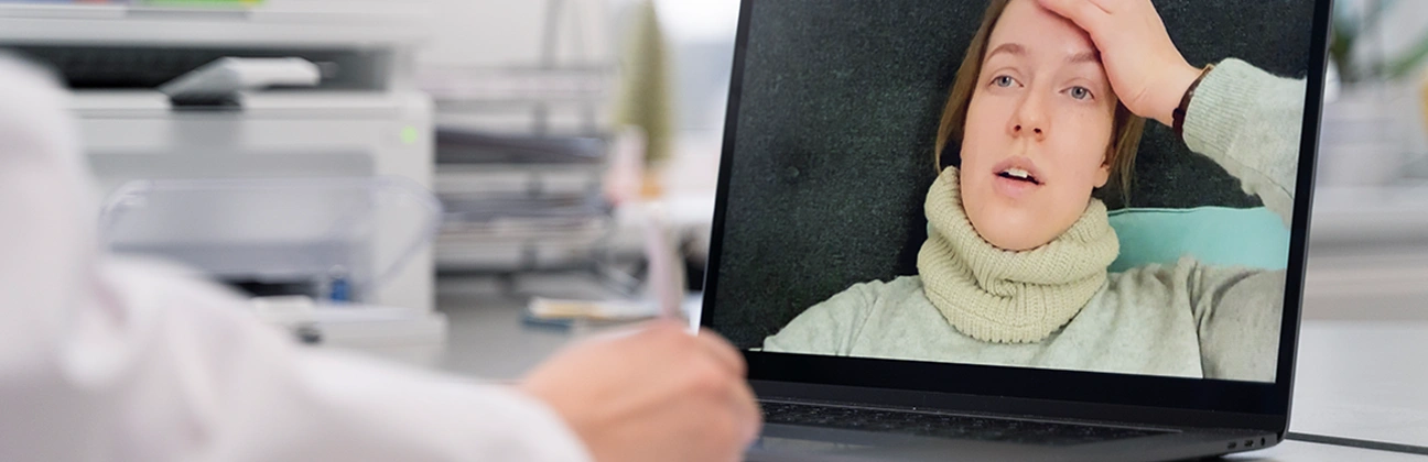 Patient speaking with a mental health professional through a secure telehealth video consultation