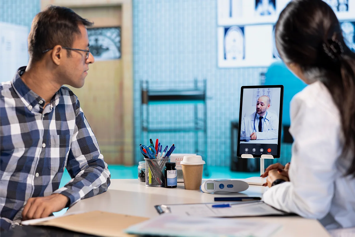 Patient comparing a telehealth video consultation with an in-person doctor visit